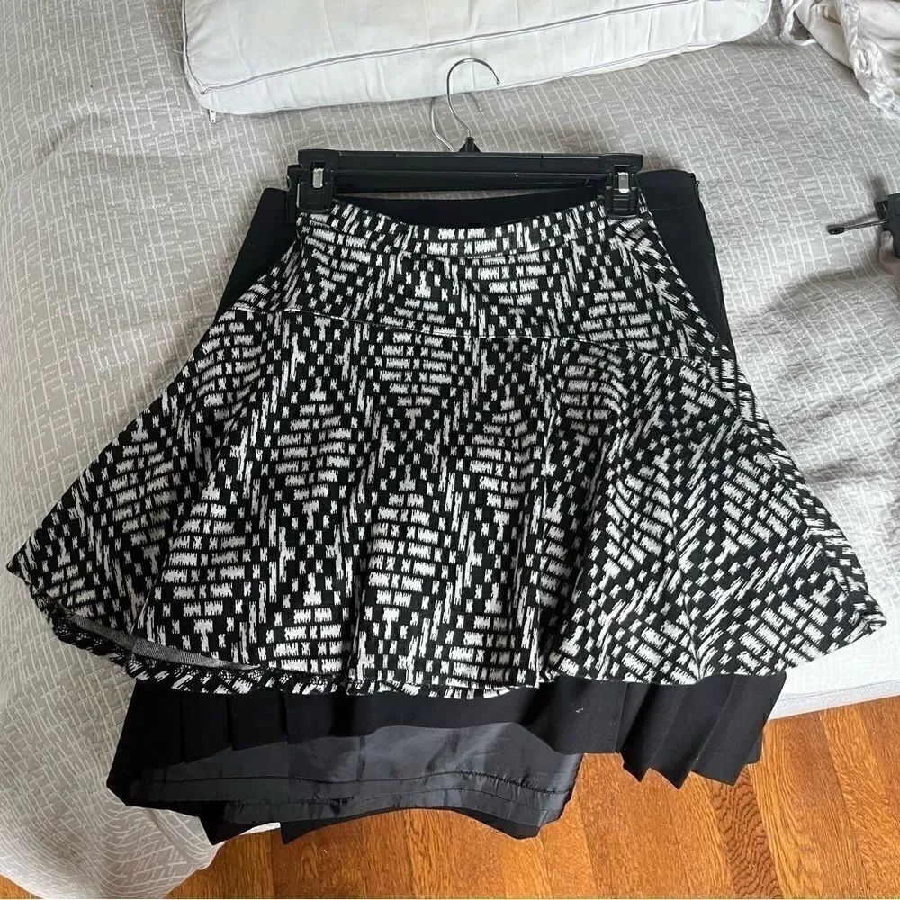 Aqua(Bloomingdales) black and white patterned circle skirt.